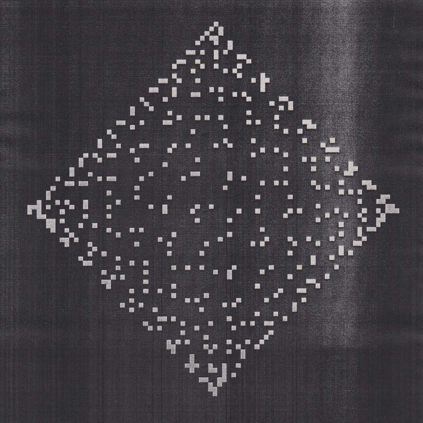Photocopy of a diamond-shaped goniometer on a dark background.