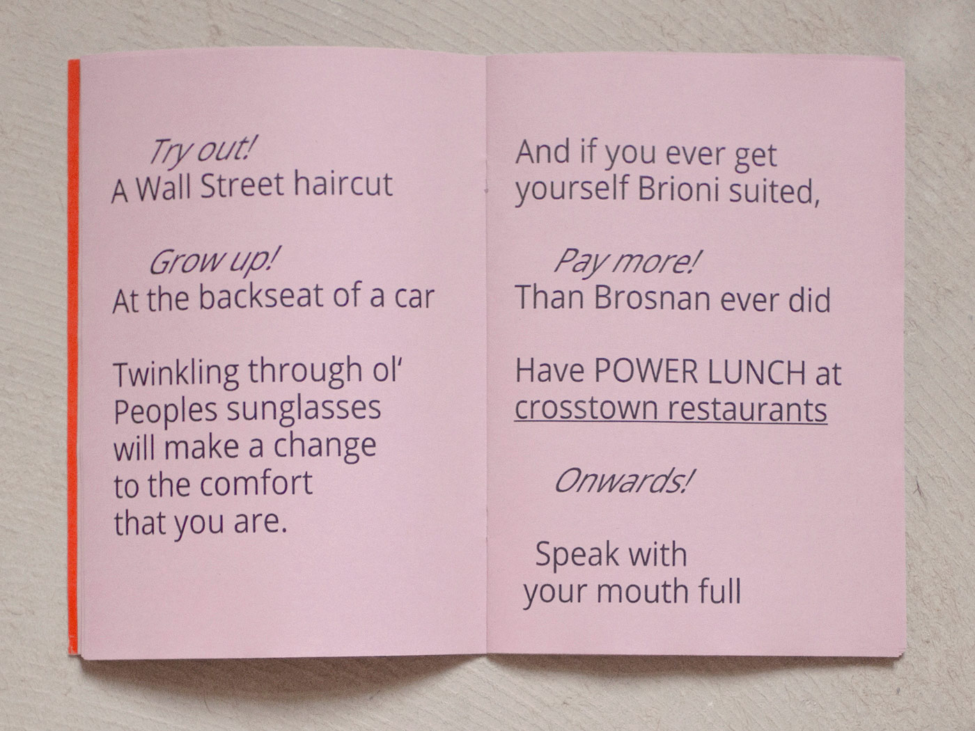 A laid-on booklet with pink-colored side paper and signal orange cover. The open double page shows a poem about the stock exchange. The poem is printed in a sans serif font.