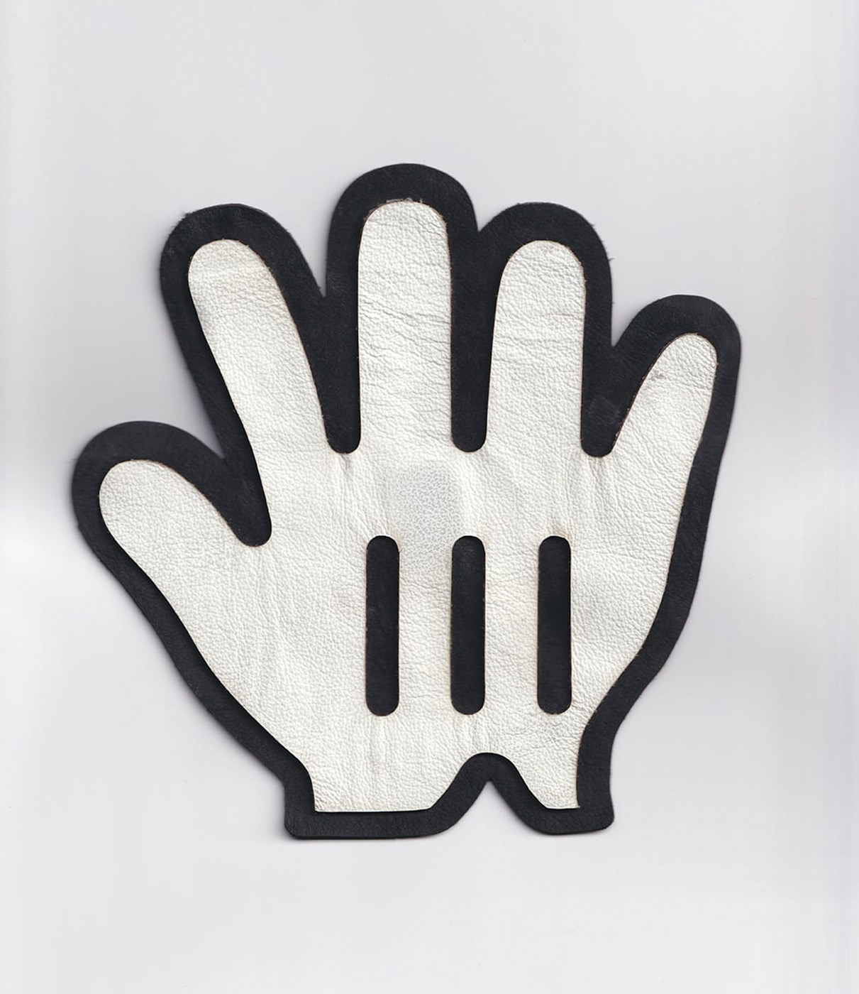 A scan of an upscaled version of the cursor:grab value made of leather.